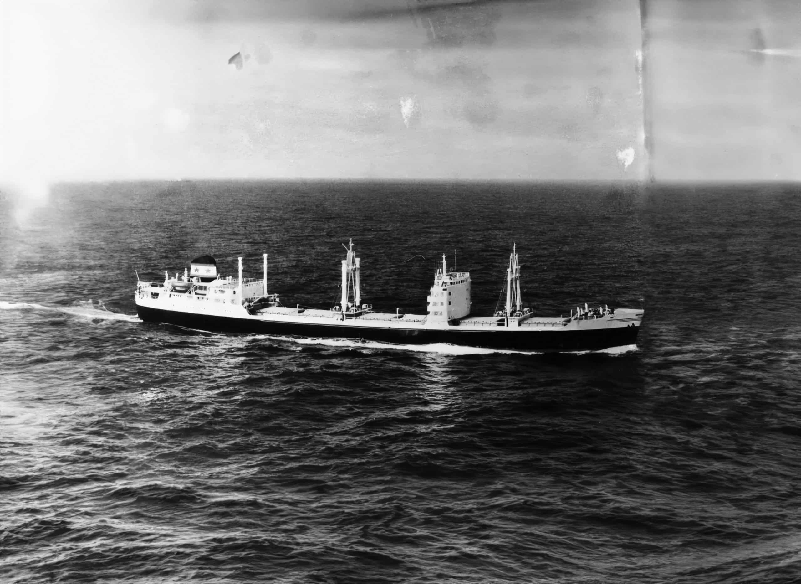 An old ship sailing at sea.