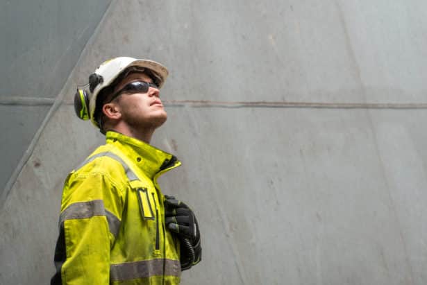 A worker checking if everything is under control, evaluating and managing risks.