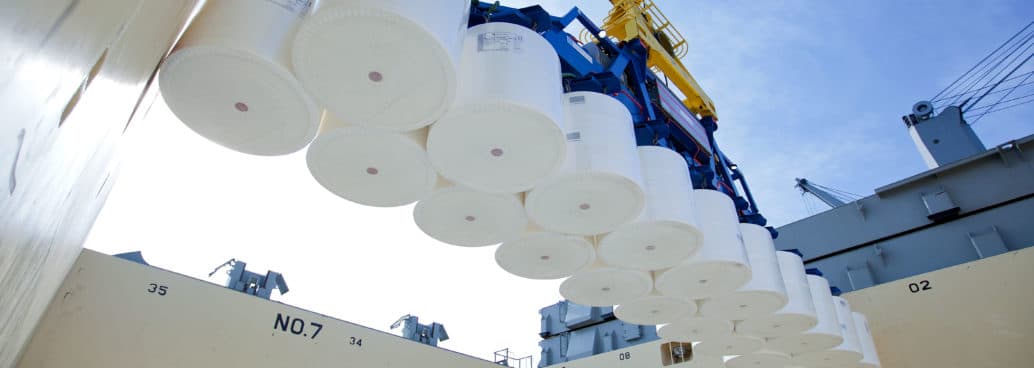 A machine placing cargo on board of a vessel.